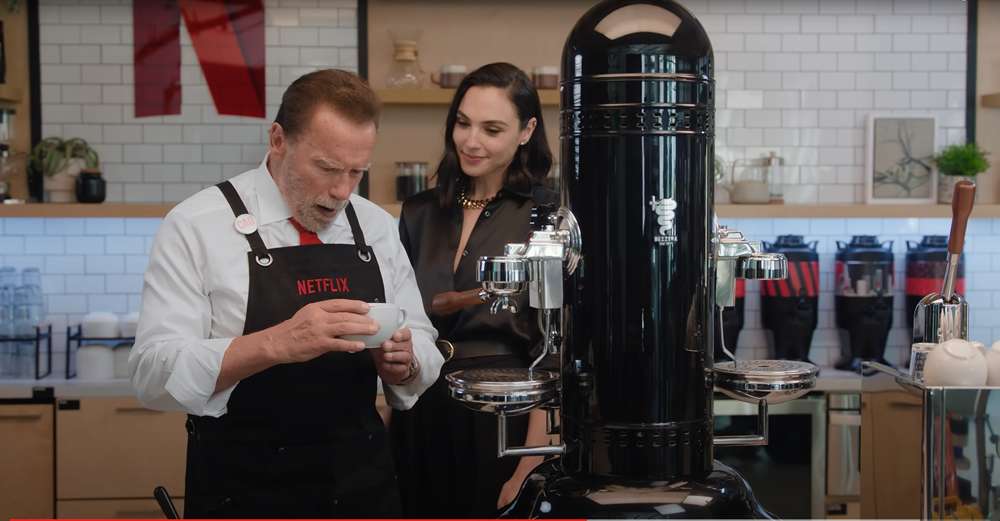 Gal Gadot and Arnold Schwarzenegger admiring a cup of Caffe Latte made by Bezzera Verticale Black Eagle 2 Group Coffee Machine